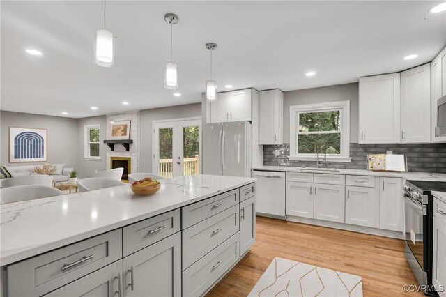 4712 Kyloe Ln, Moseley, VA 23120 - kitchen featuring white appliances, decorative backsplash, hanging light fixtures, open floor plan, and recessed lighting