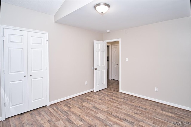 6434 Anderson Hwy, Powhatan, VA 23139 - unfurnished bedroom with wood finished floors and a closet