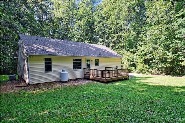 6434 Anderson Hwy, Powhatan, VA 23139 - back of house featuring a wooden deck, a lawn, roof with shingles, and a forest view