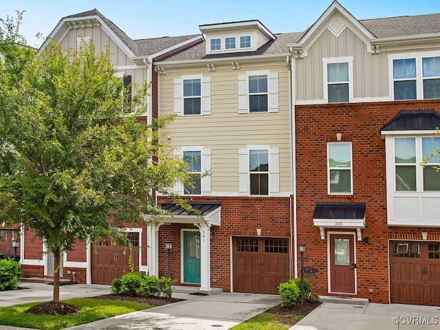341 Crofton Village Ter Unit Kd, Chesterfield, VA 23114 - view of property featuring board and batten siding, driveway, brick siding, and a garage