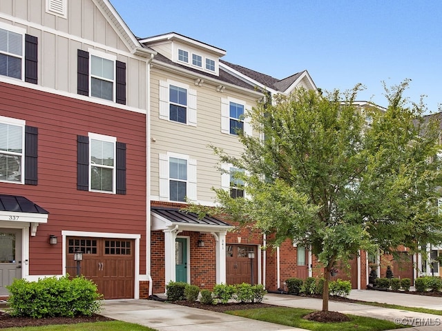 341 Crofton Village Ter Unit Kd, Chesterfield, VA 23114 - townhome / multi-family property featuring board and batten siding, concrete driveway, and an attached garage
