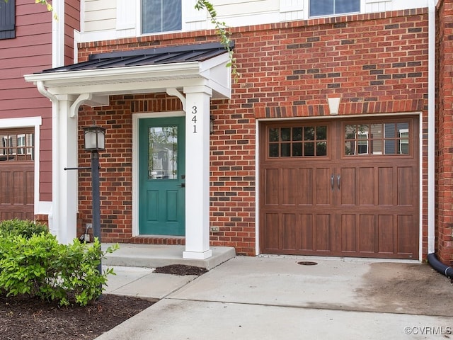 341 Crofton Village Ter Unit Kd, Chesterfield, VA 23114 - doorway to property with driveway, brick siding, and an attached garage