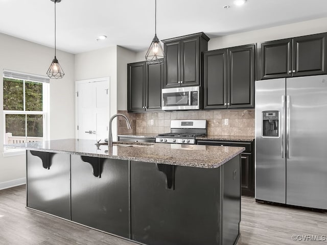 341 Crofton Village Ter Unit Kd, Chesterfield, VA 23114 - kitchen featuring appliances with stainless steel finishes, light wood finished floors, stone countertops, tasteful backsplash, and recessed lighting