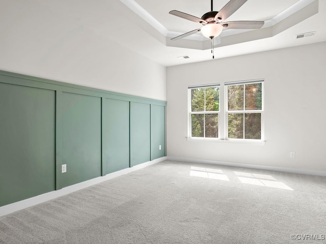 341 Crofton Village Ter Unit Kd, Chesterfield, VA 23114 - carpeted spare room featuring a ceiling fan, a tray ceiling, and a decorative wall
