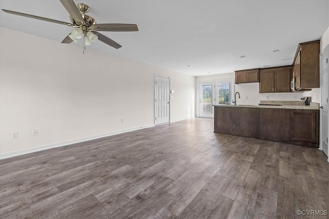 11325 Webb Rd, Disputanta, VA 23842 - kitchen featuring open floor plan, dark wood-style flooring, a ceiling fan, dark brown cabinets, and light countertops