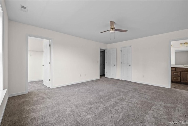 11325 Webb Rd, Disputanta, VA 23842 - unfurnished bedroom with carpet floors, connected bathroom, and a ceiling fan