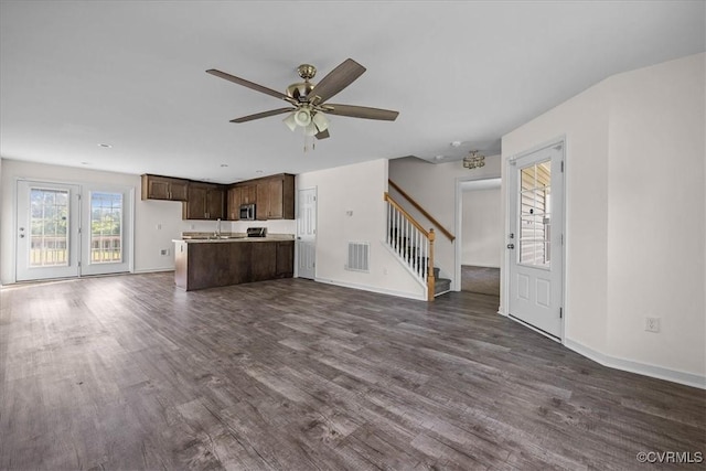 11325 Webb Rd, Disputanta, VA 23842 - unfurnished living room featuring dark wood finished floors, stairway, and a ceiling fan