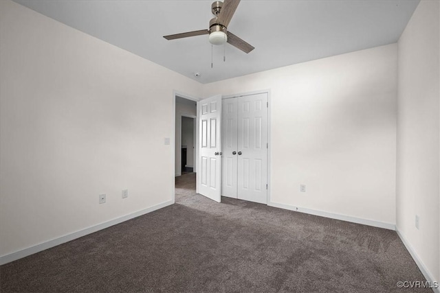 11325 Webb Rd, Disputanta, VA 23842 - unfurnished bedroom featuring dark colored carpet, a closet, and ceiling fan