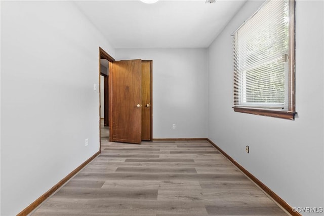 11900 James River Dr, North Prince George, VA 23860 - unfurnished bedroom with baseboards and light wood-style flooring