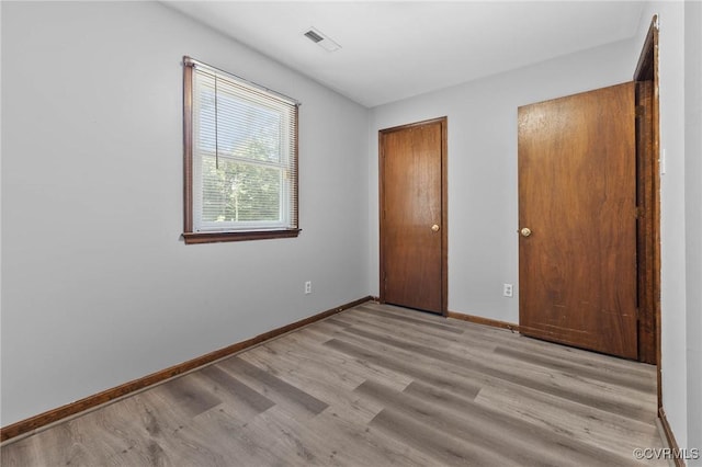 11900 James River Dr, North Prince George, VA 23860 - unfurnished bedroom with light wood finished floors and baseboards
