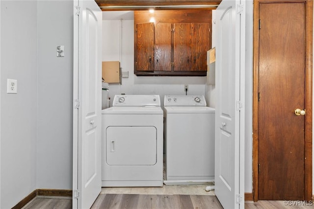 11900 James River Dr, North Prince George, VA 23860 - washroom featuring cabinet space, washer and clothes dryer, and light wood-type flooring