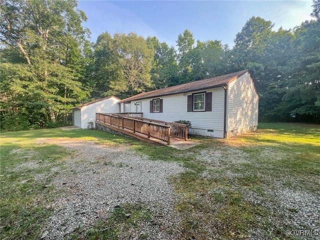 11900 James River Dr, North Prince George, VA 23860 - back of property with crawl space, a wooden deck, a lawn, and driveway