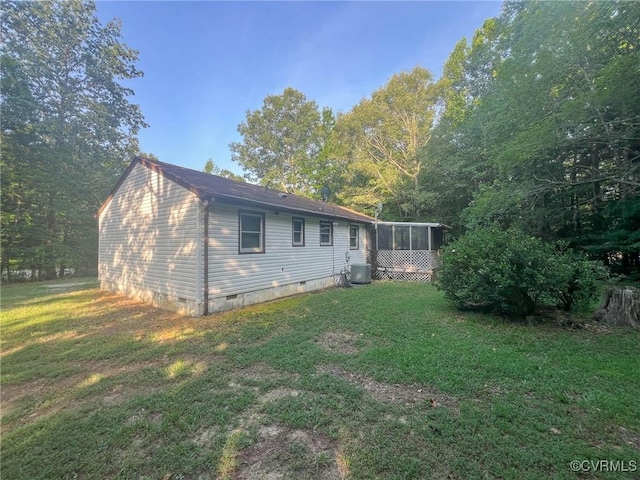 11900 James River Dr, North Prince George, VA 23860 - rear view of property with crawl space, a sunroom, and a lawn