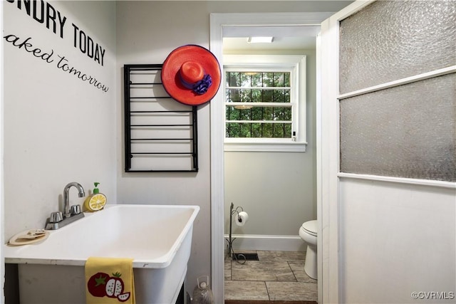 544 High St, Petersburg, VA 23803 - bathroom featuring toilet and baseboards