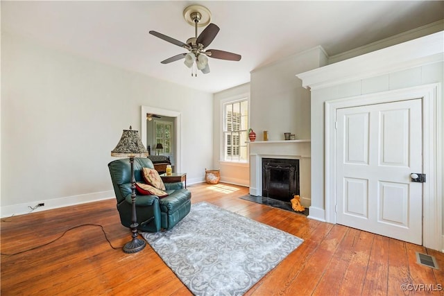 544 High St, Petersburg, VA 23803 - living area with hardwood / wood-style floors, ceiling fan, and a fireplace with flush hearth