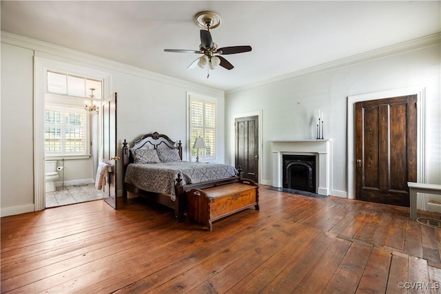 544 High St, Petersburg, VA 23803 - bedroom with hardwood / wood-style flooring, crown molding, a fireplace with flush hearth, connected bathroom, and a chandelier