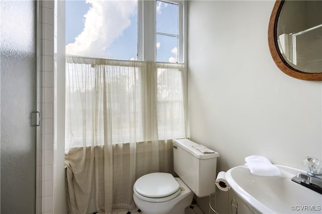 544 High St, Petersburg, VA 23803 - bathroom featuring toilet and a shower with door