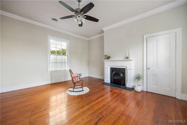 544 High St, Petersburg, VA 23803 - unfurnished living room with a fireplace with raised hearth, hardwood / wood-style flooring, a ceiling fan, and ornamental molding