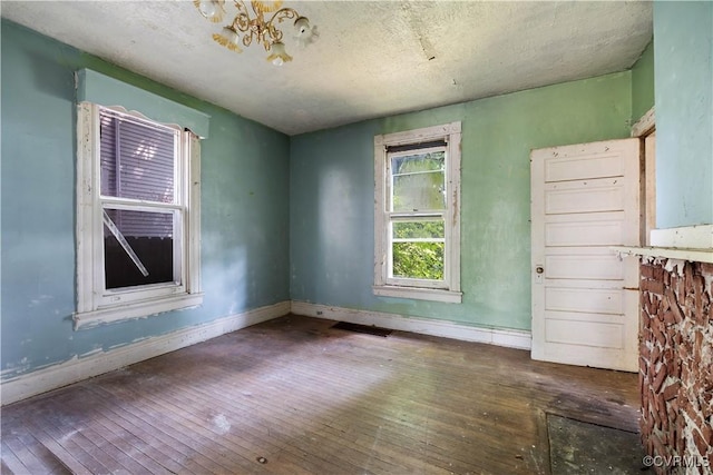 415 W 24th St, Richmond, VA 23225 - empty room with wood-type flooring and baseboards