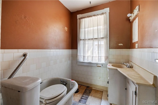 415 W 24th St, Richmond, VA 23225 - bathroom with tile walls, vanity, healthy amount of natural light, and wainscoting