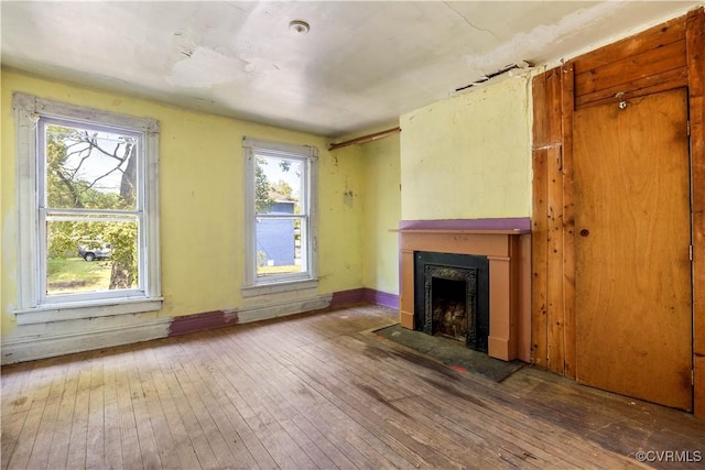 415 W 24th St, Richmond, VA 23225 - unfurnished living room with a fireplace with flush hearth and hardwood / wood-style floors