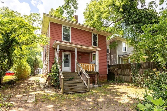 415 W 24th St, Richmond, VA 23225 - traditional style home featuring a porch and a chimney