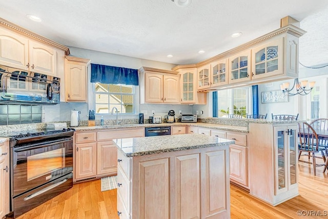 1382 Glebe Landing Rd, Center Cross, VA 22437 - kitchen featuring electric range, light brown cabinets, a peninsula, dishwasher, and light wood-style floors