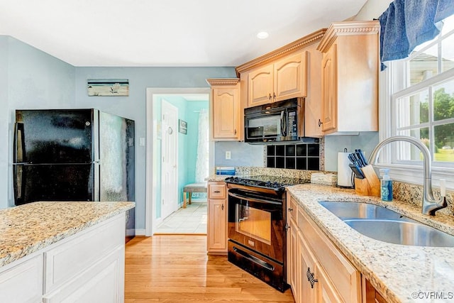 1382 Glebe Landing Rd, Center Cross, VA 22437 - kitchen featuring black appliances, light brown cabinetry, light stone counters, light wood-style floors, and recessed lighting