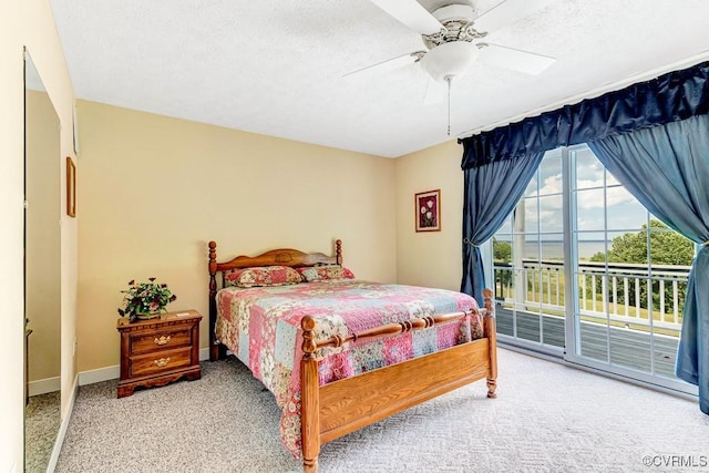 1382 Glebe Landing Rd, Center Cross, VA 22437 - bedroom featuring access to exterior, carpet flooring, a ceiling fan, and a textured ceiling