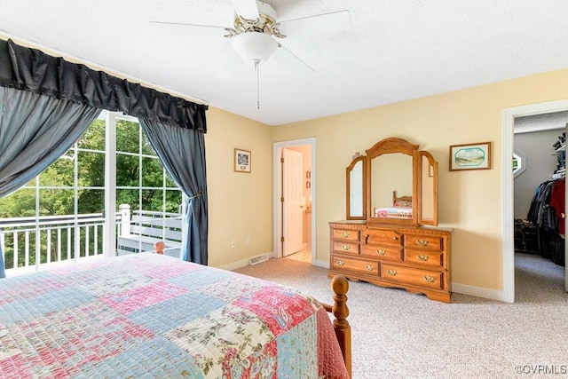 1382 Glebe Landing Rd, Center Cross, VA 22437 - carpeted bedroom with a walk in closet, a ceiling fan, and access to exterior