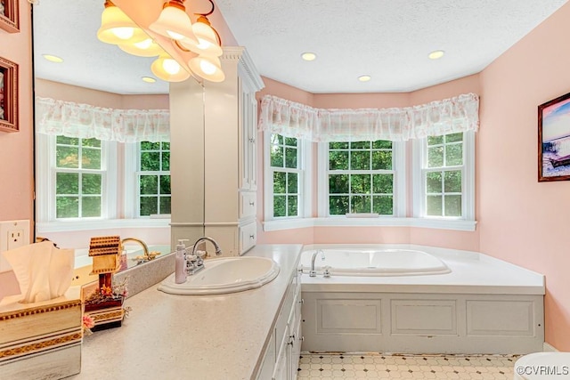 1382 Glebe Landing Rd, Center Cross, VA 22437 - full bath featuring plenty of natural light, a bath, vanity, recessed lighting, and a textured ceiling
