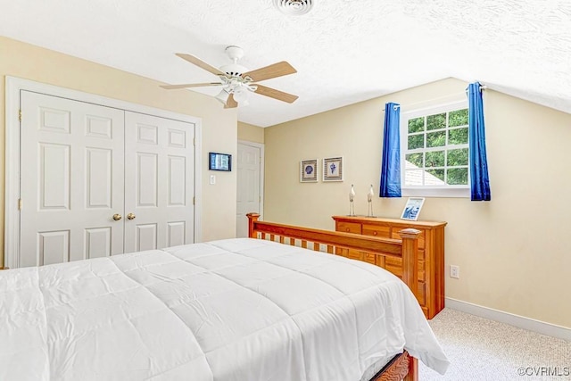 1382 Glebe Landing Rd, Center Cross, VA 22437 - carpeted bedroom featuring a textured ceiling, a closet, a ceiling fan, and lofted ceiling
