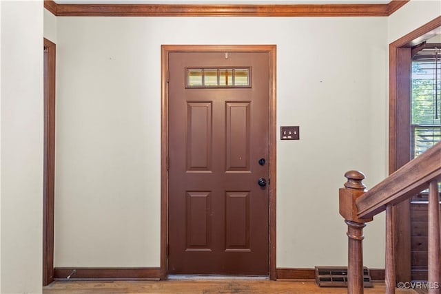 11906 Exbury Ter, Midlothian, VA 23114 - entrance foyer with crown molding, wood finished floors, and stairway