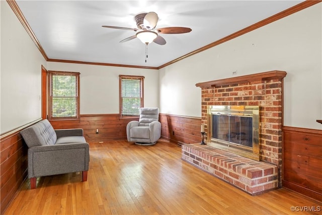 11906 Exbury Ter, Midlothian, VA 23114 - living area with a wainscoted wall, hardwood / wood-style flooring, a fireplace, ceiling fan, and wood walls