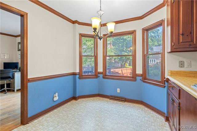 11906 Exbury Ter, Midlothian, VA 23114 - unfurnished dining area with a chandelier, healthy amount of natural light, ornamental molding, and an office area
