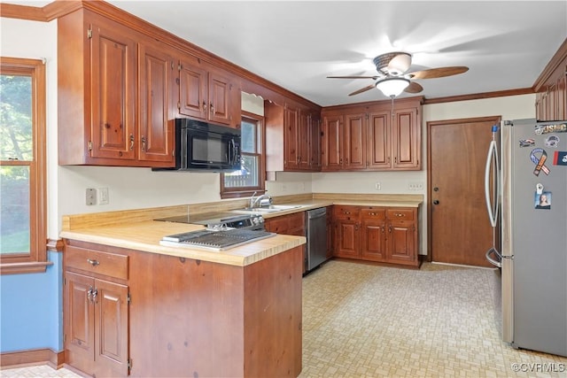 11906 Exbury Ter, Midlothian, VA 23114 - kitchen featuring appliances with stainless steel finishes, light countertops, a peninsula, ceiling fan, and brown cabinets