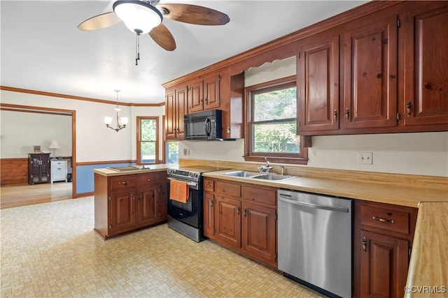 11906 Exbury Ter, Midlothian, VA 23114 - kitchen featuring stainless steel appliances, light countertops, healthy amount of natural light, a peninsula, and ornamental molding