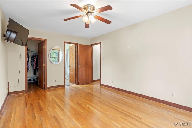 11906 Exbury Ter, Midlothian, VA 23114 - unfurnished bedroom with a spacious closet, light wood-style flooring, a closet, and ceiling fan