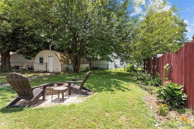 2210 W City Point Rd, Hopewell, VA 23860 - fenced backyard featuring a fire pit and a storage shed