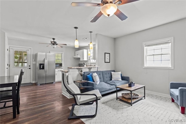 2210 W City Point Rd, Hopewell, VA 23860 - living area featuring ceiling fan and dark wood-type flooring
