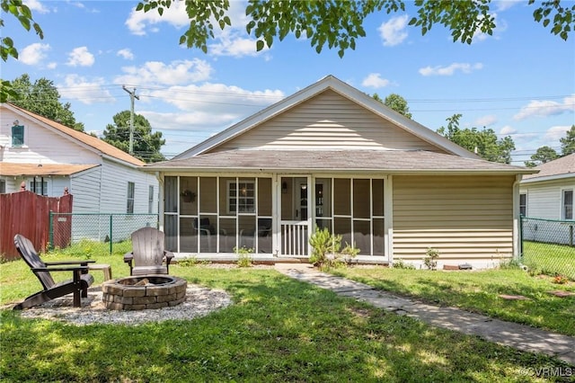 2210 W City Point Rd, Hopewell, VA 23860 - back of property with an outdoor fire pit and a sunroom