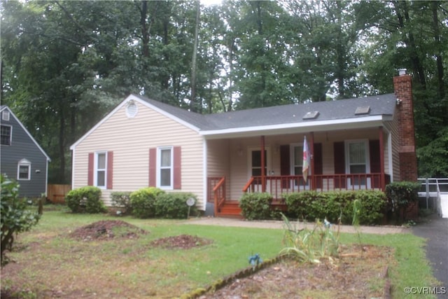 7401 Velvet Antler Dr, Midlothian, VA 23112 - view of front of house with a chimney, a porch, and a front yard