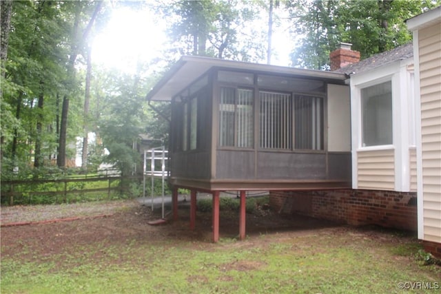 7401 Velvet Antler Dr, Midlothian, VA 23112 - view of side of property featuring a sunroom, a chimney, and brick siding