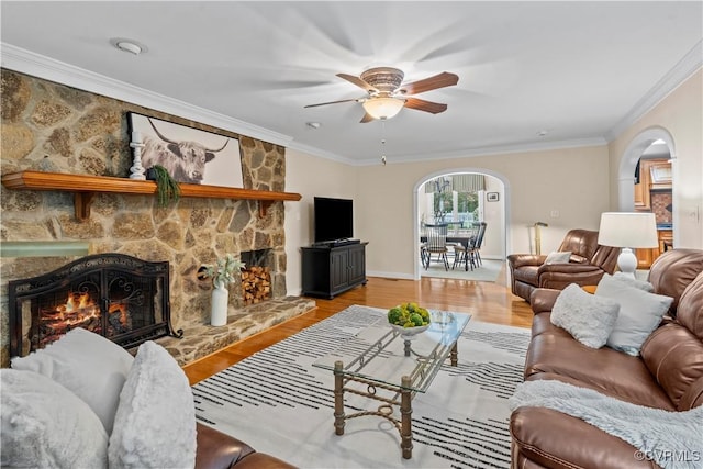 18030 W County Line Rd, Midlothian, VA 23112 - living area with arched walkways, ceiling fan, ornamental molding, a stone fireplace, and wood finished floors