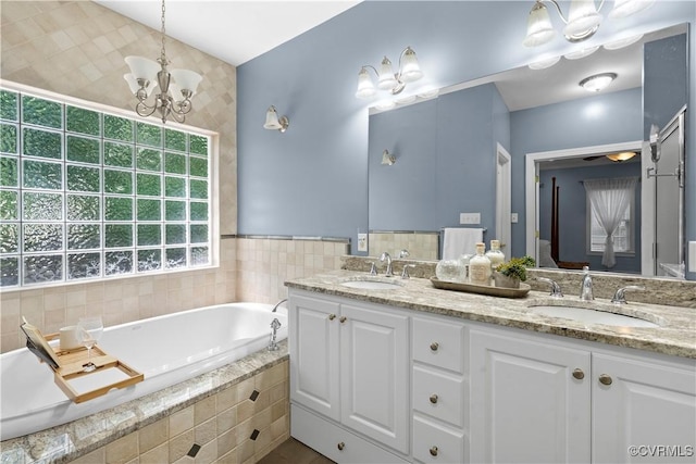 18030 W County Line Rd, Midlothian, VA 23112 - full bath featuring double vanity, a bath, and a chandelier