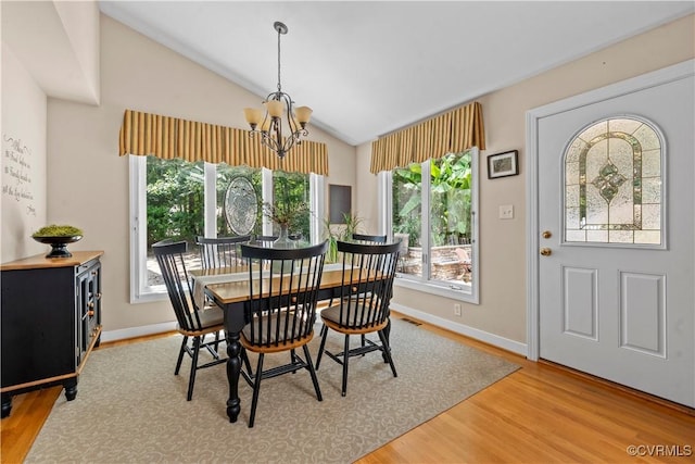 18030 W County Line Rd, Midlothian, VA 23112 - dining room with vaulted ceiling, a chandelier, and wood finished floors