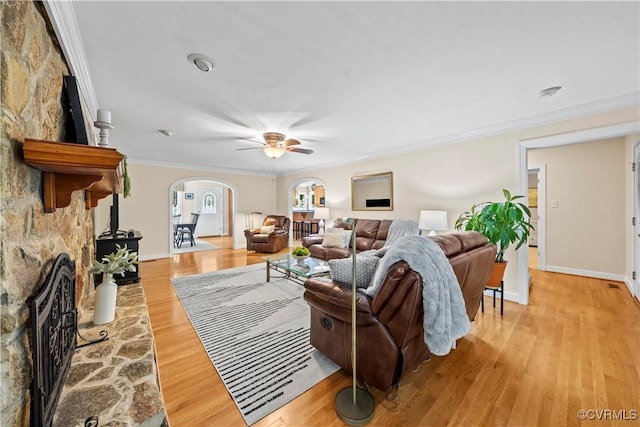 18030 W County Line Rd, Midlothian, VA 23112 - living area featuring arched walkways, ornamental molding, ceiling fan, light wood-style floors, and a fireplace