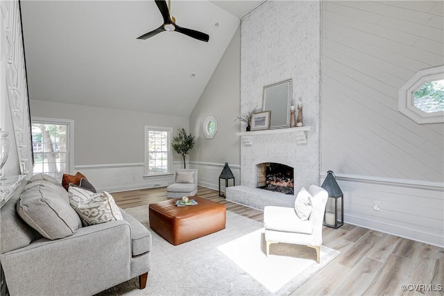 2613 Teaberry Dr, North Chesterfield, VA 23236 - living area with wood finished floors, plenty of natural light, a fireplace, high vaulted ceiling, and wainscoting