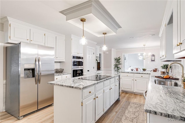 2613 Teaberry Dr, North Chesterfield, VA 23236 - kitchen with stainless steel appliances, white cabinets, light stone counters, light wood-style floors, and a peninsula