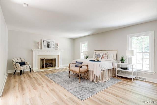 2613 Teaberry Dr, North Chesterfield, VA 23236 - bedroom featuring multiple windows, wood finished floors, and a fireplace